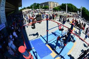 KHARKIV, UKRAINE - 27 MAY, 2022 Street workout show during the annual festival of street cultures photo