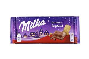 KHARKOV. UKRAINE - MAY 17, 2022 Milka spekulaas gingerbread chocolate bar. Milka is a Swiss brand of chocolate confection manufactured by company Mondelez International photo