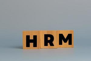 Wood cube HRM human resources management on background.Business strategy skill employee concept. photo