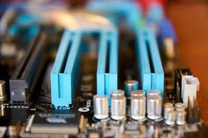 motherboard IEEE 1394a audio codec and controller chips, PCI slots and PCI-e x1 slots closeup photo