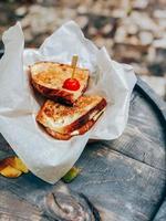 Sandwich on paper. Street food concept photo