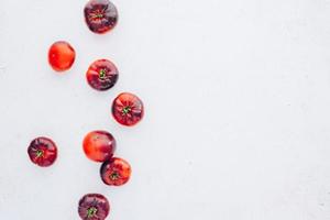 Tomatoes Mar Azul on white wooden table background photo