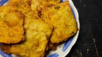 Homemade fried tempeh on a black background 02 photo