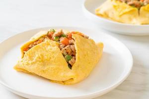 egg wrap or stuffed egg with minced pork and vegetable photo