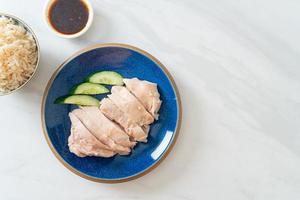 Hainanese chicken rice or rice steamed with chicken soup photo