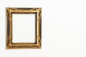 empty picture frame on white wall background photo