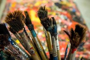 Old paintbrush on art work table photo