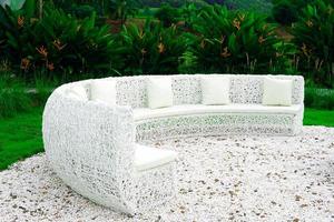 field sofa, artificial rattan sofa Used architecture to sit and relax outdoors and admire the natural scenery and the surrounding trees. Soft and selective focus. photo