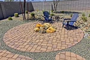 Rear Yard Conversation Area With Arm Chairs And Pavers photo