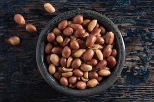 Peanuts with Skins in a Bowl photo