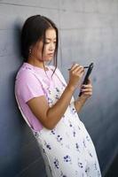 Asian woman browsing data on smartphone photo