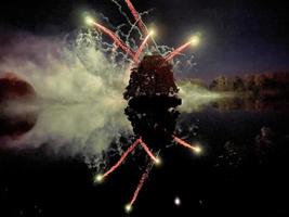 una vista de un espectáculo de fuegos artificiales en el lago alderford en whitchurch foto