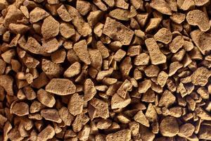 Instant, dark, dry freeze-dried coffee close-up. Food background photo
