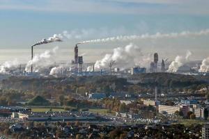 aerial panoramic view on smoke of pipes of chemical enterprise plant. Industrial landscape environmental pollution waste plant. Air pollution concept. photo