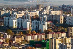 aerial panoramic view from height of a multi-storey residential complex and urban development in autumn day photo