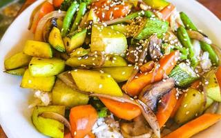 Fried rice and vegetables on white plate Puerto Escondido Mexico. photo