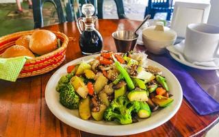 Fried rice and vegetables on white plate Puerto Escondido Mexico. photo