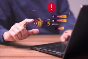 Man typing login and password, cyber security concept, Secure encryption and access to the user's private information to access the Internet. exclamation mark. photo