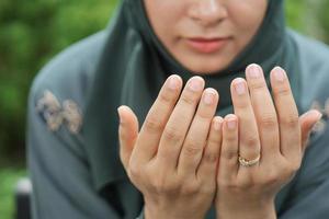 Close up of muslim women hand praying at ramadan photo