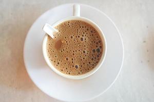 close up of cup of milk tea on table photo