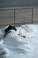 4 year old child girl sleeping on bed photo