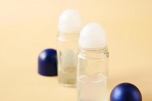 deodorants and cream container on table photo