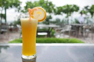 glass of orange juice outdoor photo