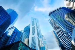 low angle view of singapore city buildings. photo