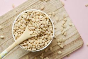 overhead view of pine nuts in a bowl photo