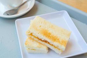 kaya toast with a cup of tea on table photo