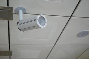 CCTV security camera operating outdoor photo