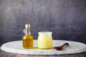homemade ghee in container on a table , photo