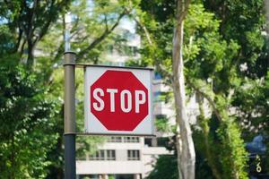 Stop sign in a empty road photo