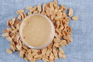 top view of peanut butter in a container , photo