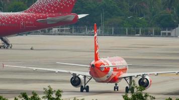 PHUKET, THAILAND DECEMBER 2, 2016 - AirAsia Airbus 320 HS BBS taxiing after landing. View from the top floor of the hotel Centara Grand West Sands Resort Phuket video