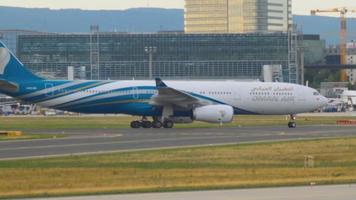 FRANKFURT AM MAIN, GERMANY SEPTEMBER 4, 2015 - OMAN Air Airbus 330 A4O DB taxiing after landing. Unofficial spotting in Fraport on Sep. 4, 2015 video