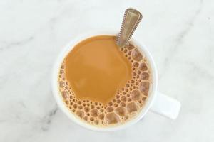 close up of cup of milk tea on table photo