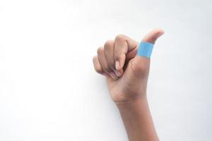 blue color adhesive bandage on hand photo