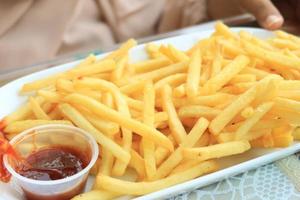 detail shot of French Fries on table photo