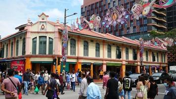 Crowd of people walking in Little India neighborhood in Singapore video