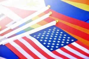 Rainbow flags and flags of many countries on floor, concept for celebration of lgbtq plus genders in pride month around the world, soft and selective focus. photo