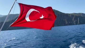 Turkish flag on a background of blue sea and sky video