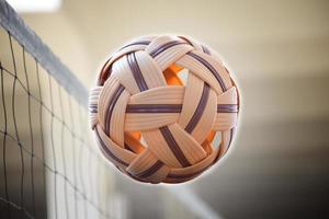Sepak takraw ball, popular sport of southeast asian countries, soft and  selective focus, outdoor sport and recreational activity concept. photo