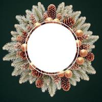Christmas wreath made of pine branches and golden ornaments.