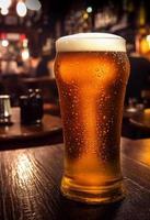 Close up of a glass of beer on a wooden table photo