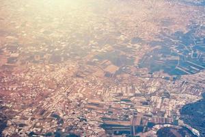 Aerial view of a city scape from airplane window photo