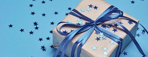 Gift box with bow and confetti, web banner