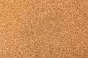 Background of brown cork board texture, close up photo