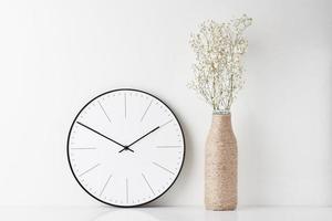 Home office minimal workspace desk with wall clock photo