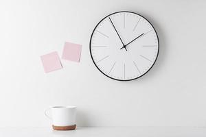 Home office minimal workspace desk with wall clock photo